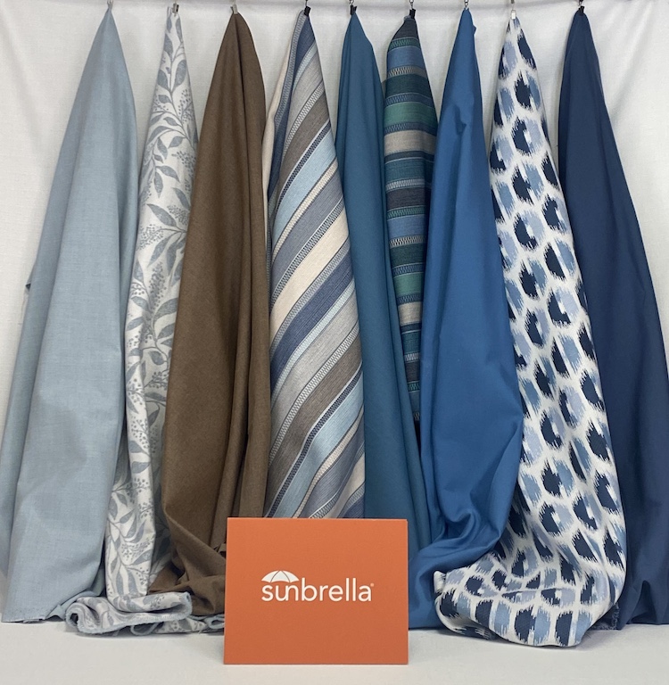 Sunbrella fabrics hanging as upholstery samples.